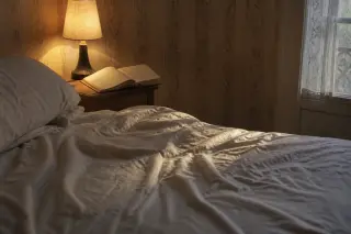 Abandoned bed at dawn with impression of a missing sleeper, half-open notebook and morning light on a nightstand, intimate atmosphere suggesting transition from dream to reality.
